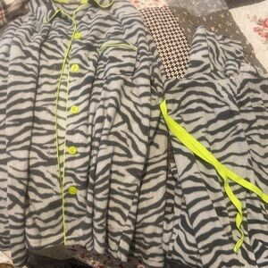 Zebra print, gray and black with fluorescent green strings, buttons and rim.